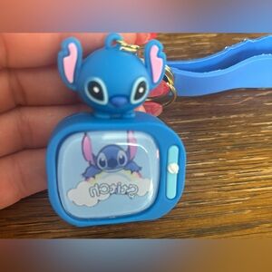 Disney Light Up Stitch on a Rainbow Cloud Keychain
